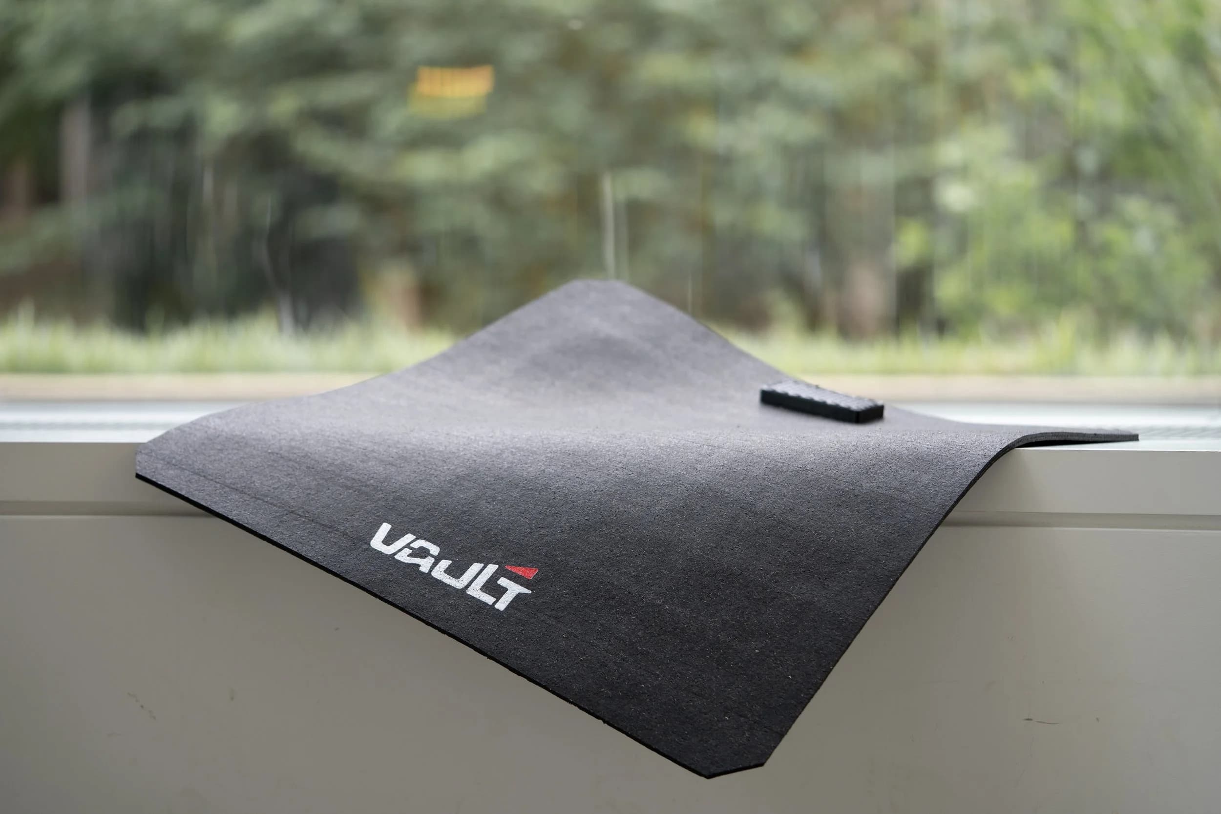 The Vault force platform draped over a windowsill, showing its thin, flexible build.